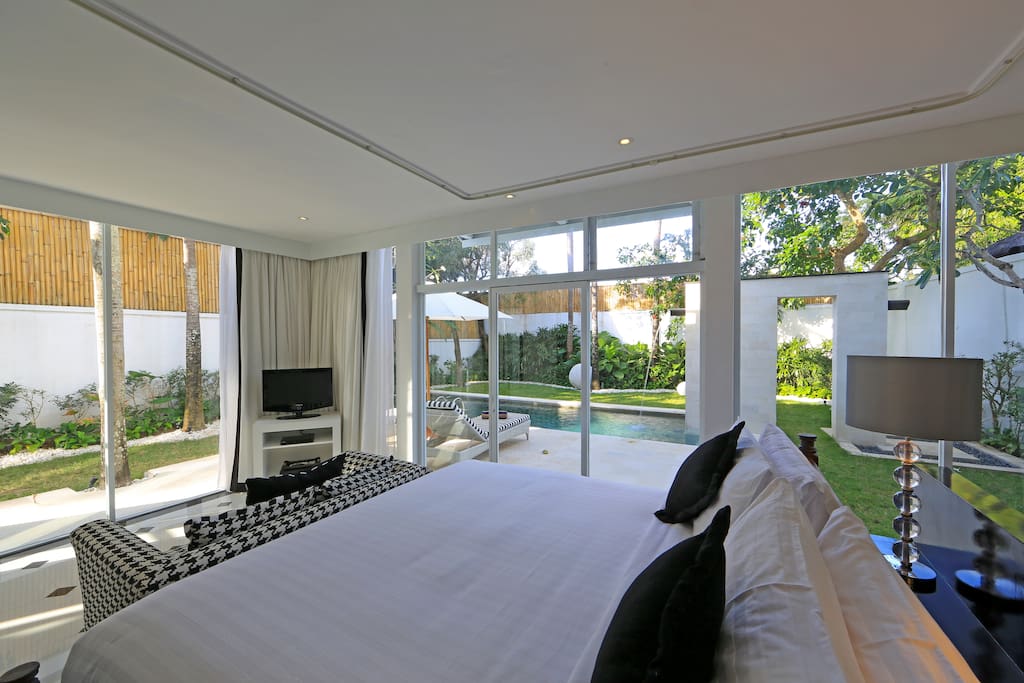 Master bedroom-King Size Bed with lush garden view and pool