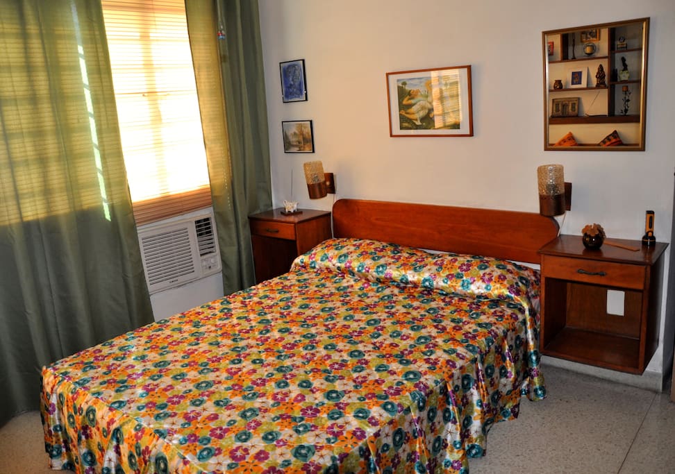 The bedroom features air conditioning and a real double bed.