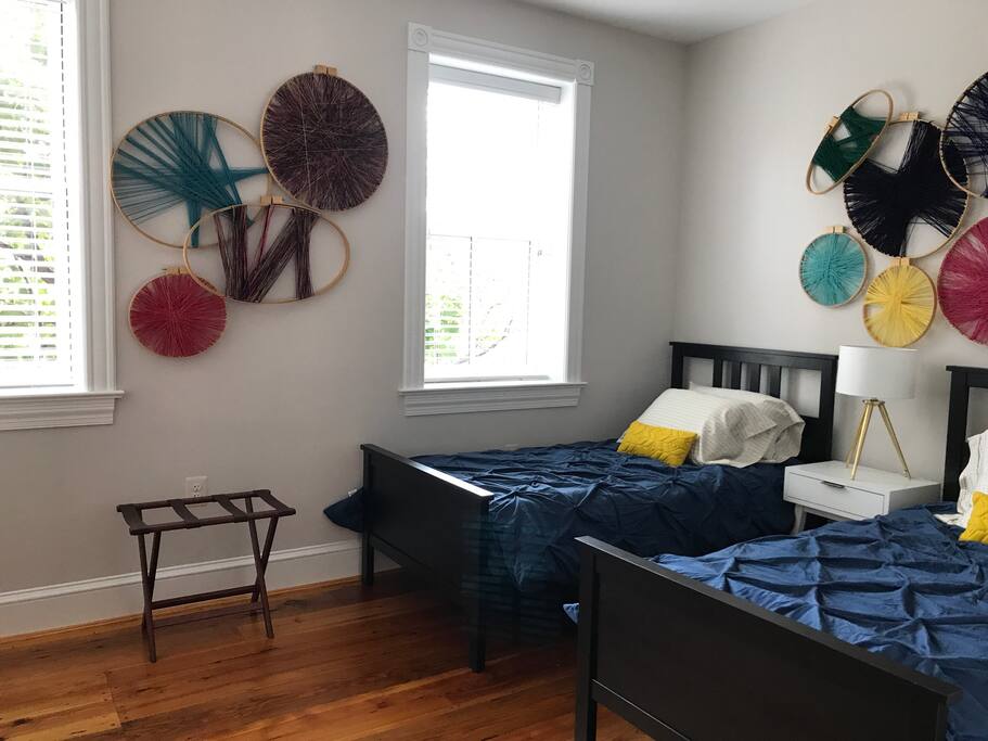 Two twin beds in bedroom #2 with south facing windows.