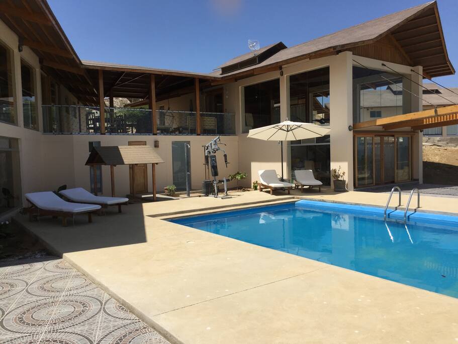 Pool deck with terraza above.