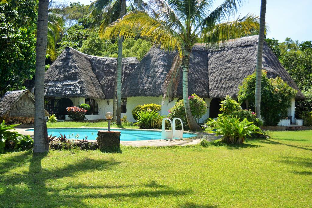 swimming pool in front of the villa