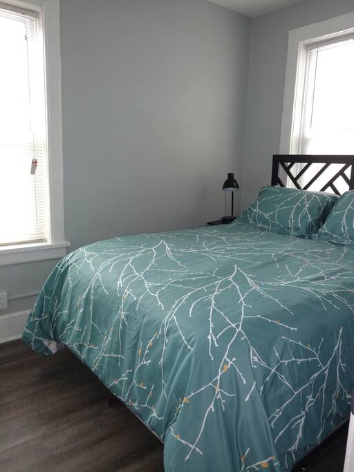 Cozy bedroom with queen size bed and two closets