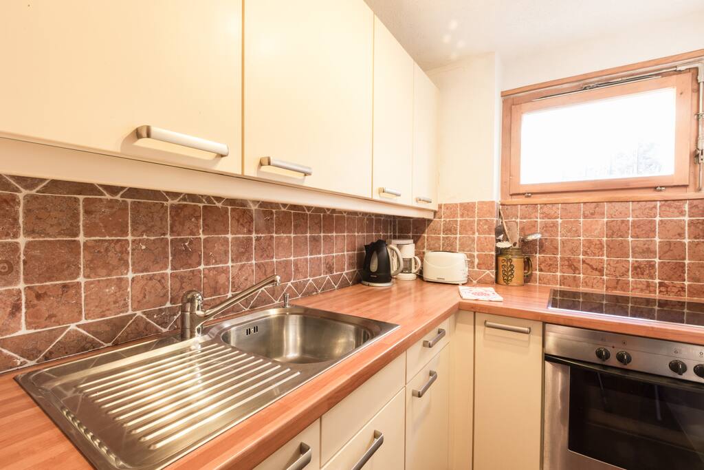 Kitchen with oven and hob