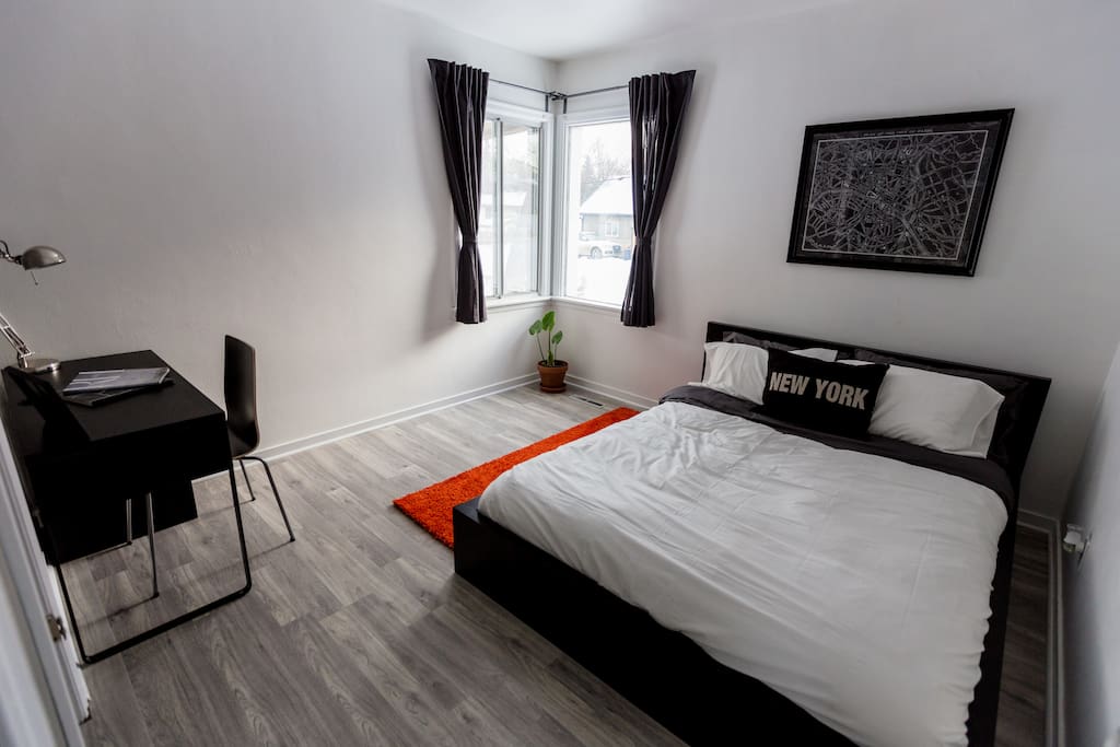 The master bedroom. Equipped with a queen pillow-top mattress, closet, and work space.
