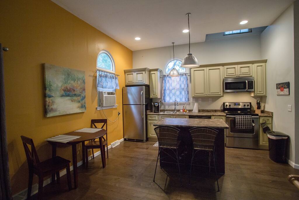 Full kitchenette with fridge/freezer, microwave, range/oven and dishwasher.