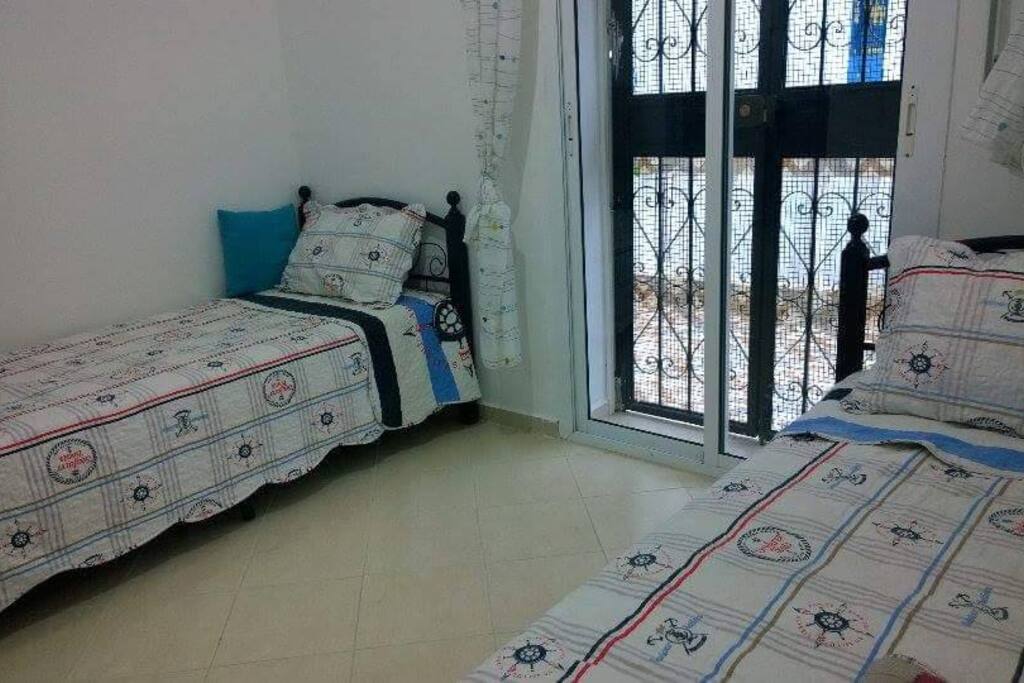 Chambre à coucher donnant sur terrasse