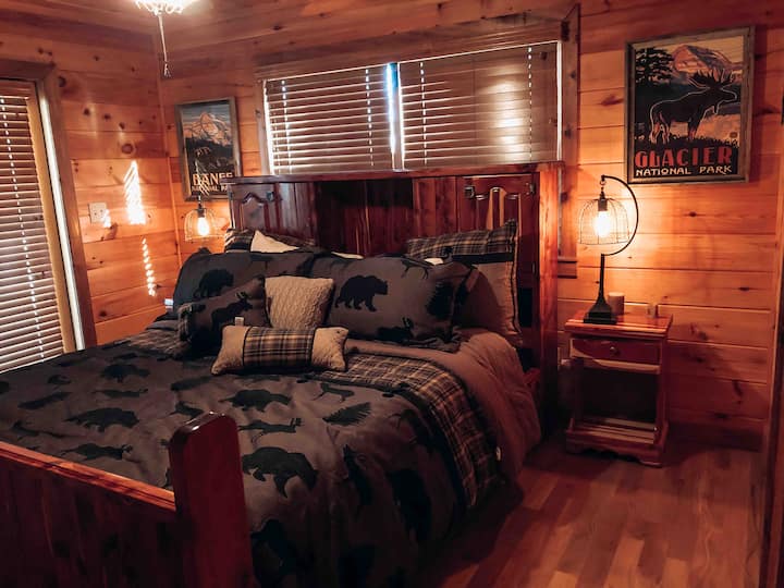 Ocoee Suite:  The main level offers another large bedroom with a California king, TV, and connected full bathroom.  This bedroom also has direct access to the full 360° wraparound porch.