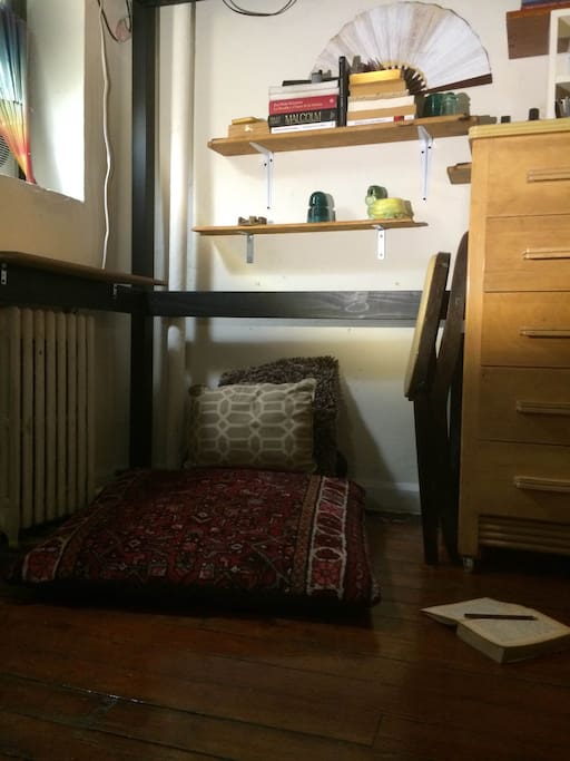 underneath the loft seating that can be converted into a desk/workspace