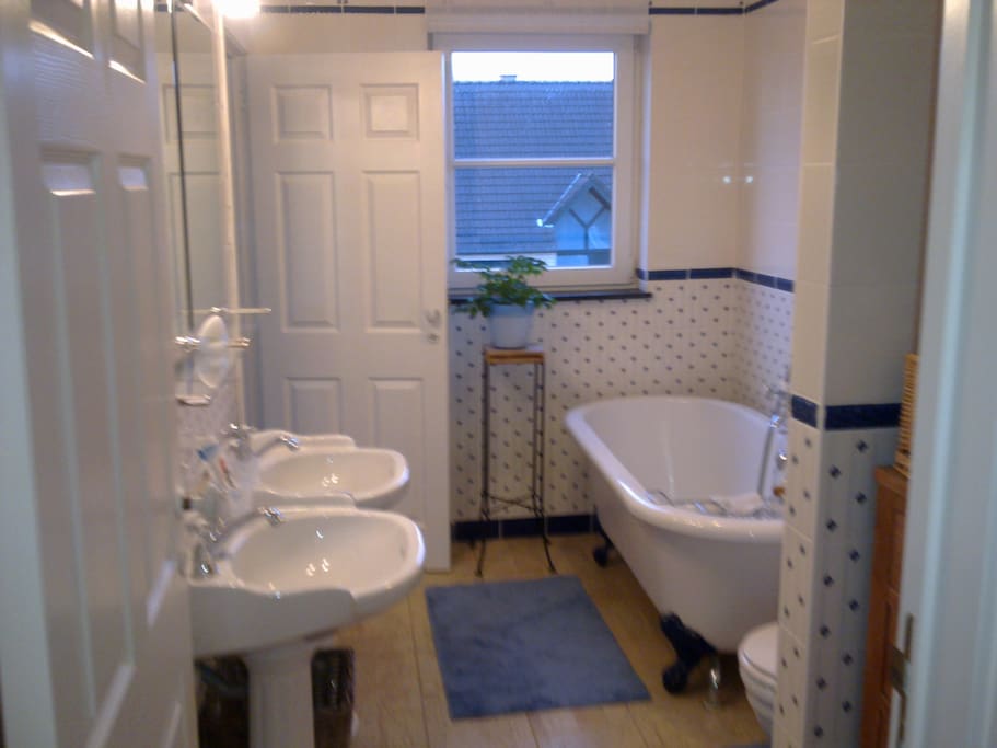 Ensuite bathroom with bath and shower