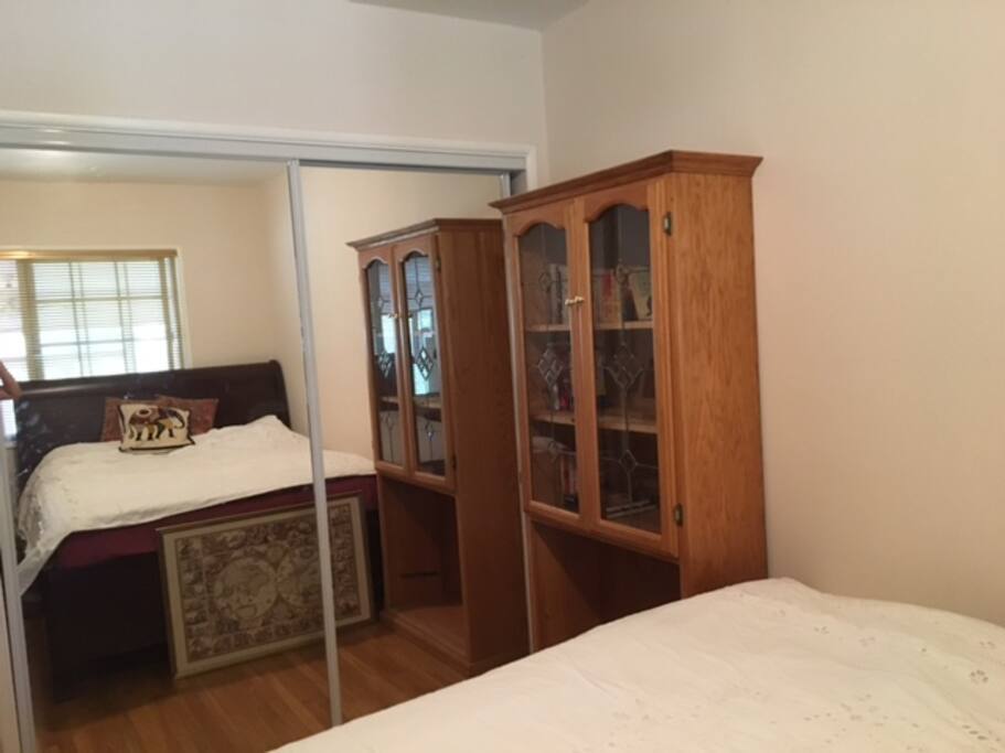 Bedroom via mirrored closets