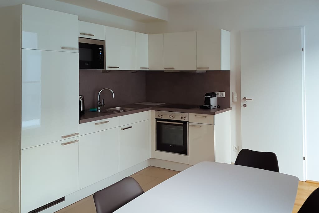 Fully equipped kitchen with oven, microwave, complimentary Nespresso coffee machine, large fridge and dishwasher