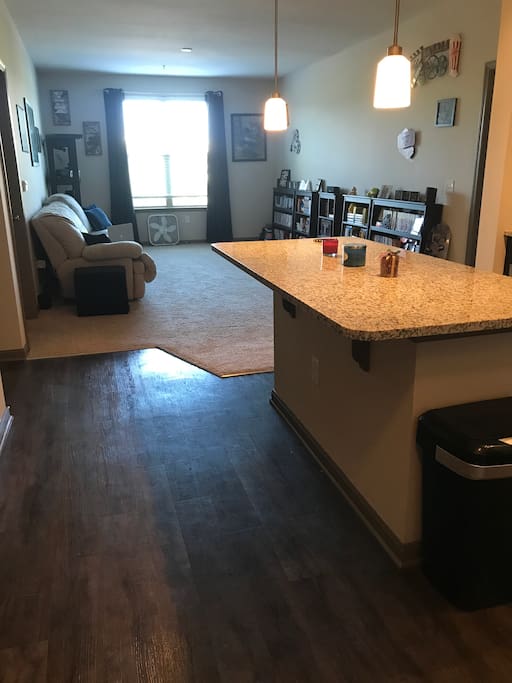 Open floor plan between kitchen and living room.