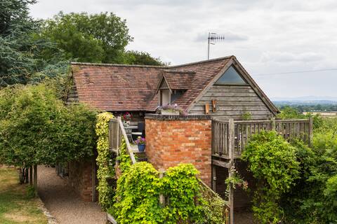 Large country studio with outside deck and views.
