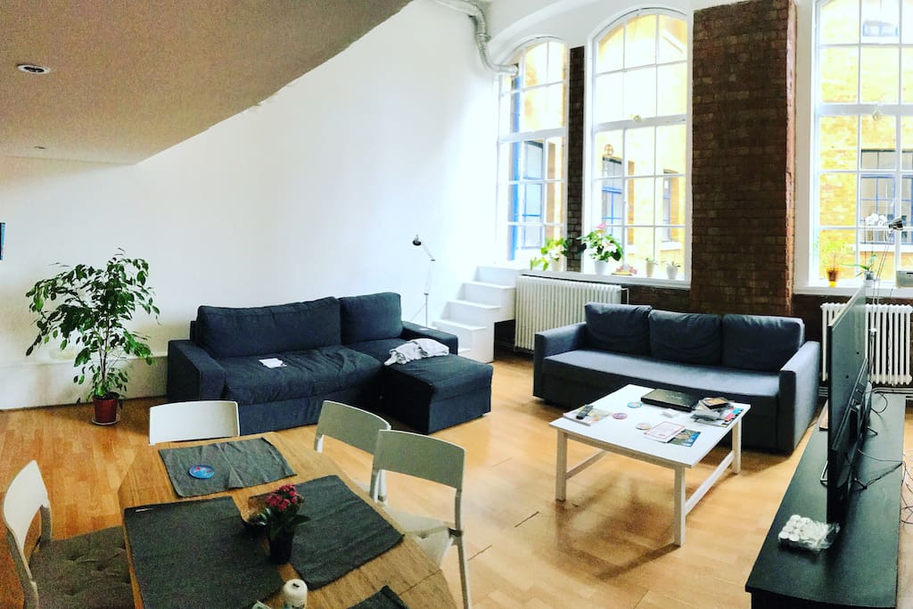 Living room is spacious and bright, has access to TV, Netflix, kitchen and fridge