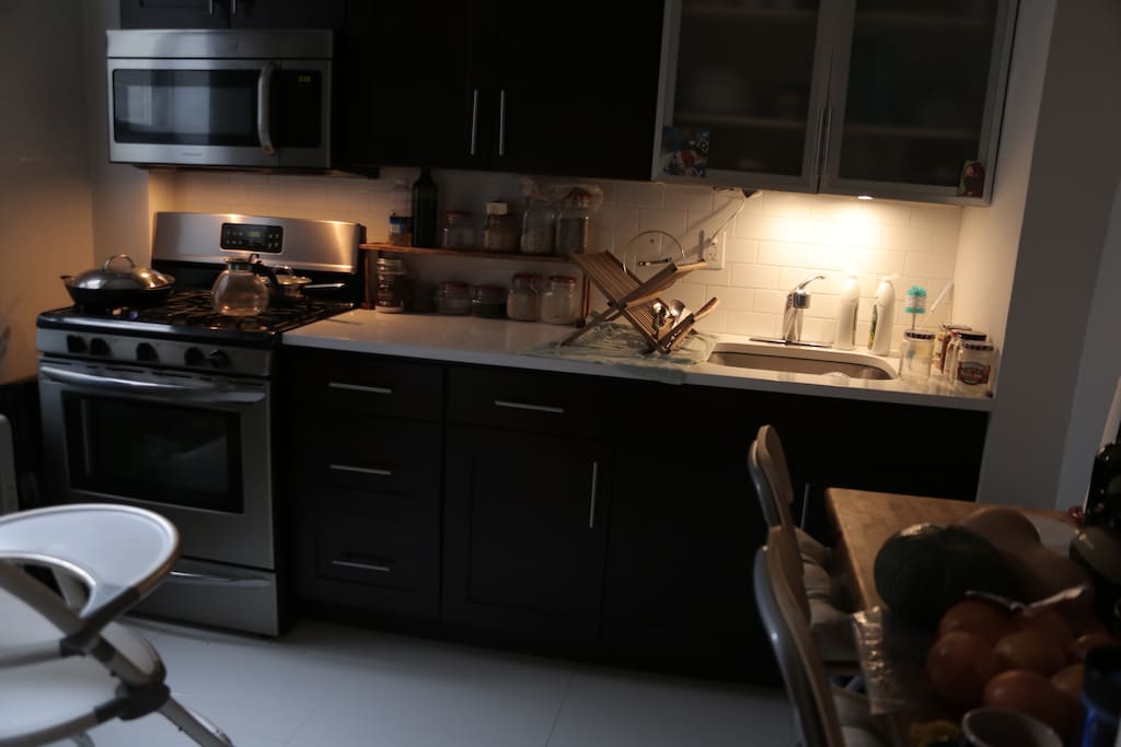 New appliances in well stocked kitchen