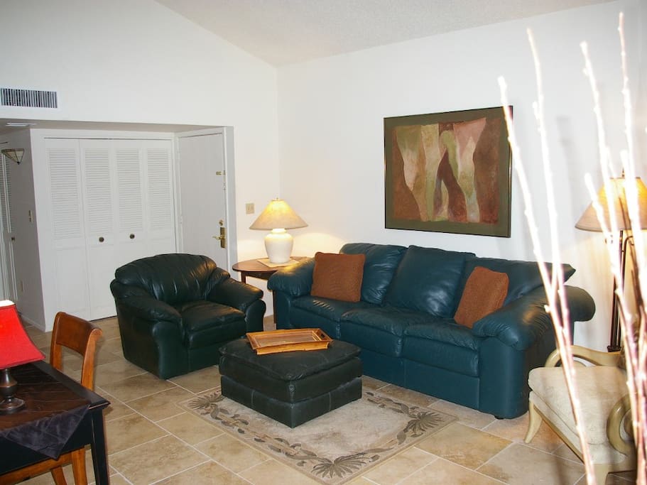 Livingroom with very comfortable chair and ottoman and pullout sofa
