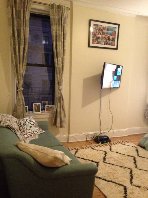 Main living room- large couch, rotating TV with cable.
