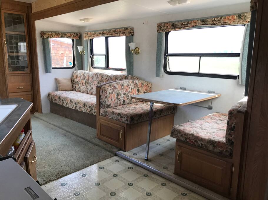 Living amenities. Sit at the kitchen table and look out at the great view!
Couch pulls down into a bed, plus the table converts to a bed. Also, an extra mattress provided for comfort.