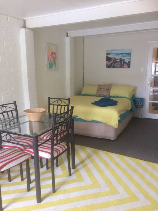 Studio room with queen bed and dining area. Totally self-contained. No link to family house.