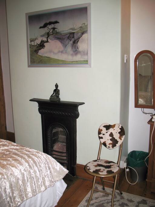 Victorian fireplace with vintage art