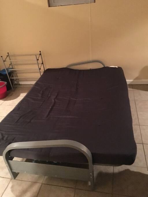 Futon couch that opens up to a bed. Sheets and pillows provided