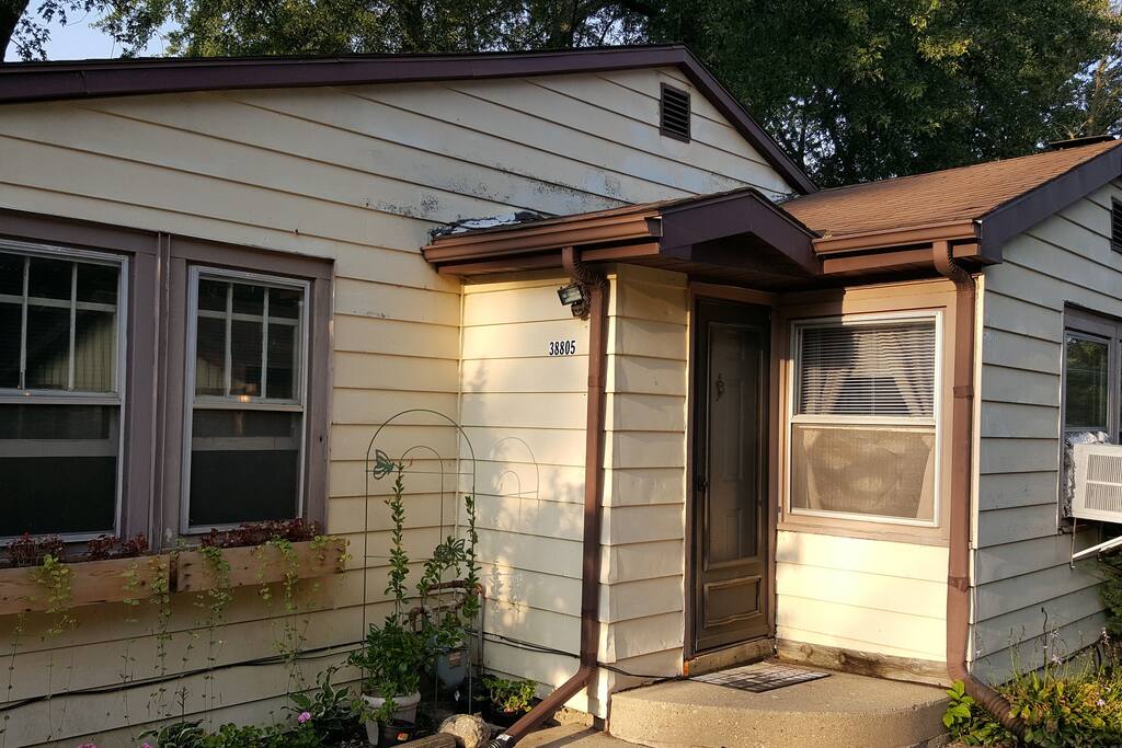 Street View of House. Needs paint and a good power washing. Not pretty.
