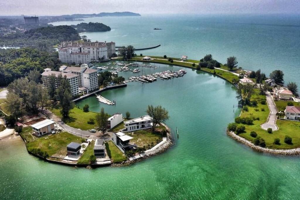 aerial view of the environment. the property is above the boats birthing area. the U shape building. photo courtesy by Fong with his mavic