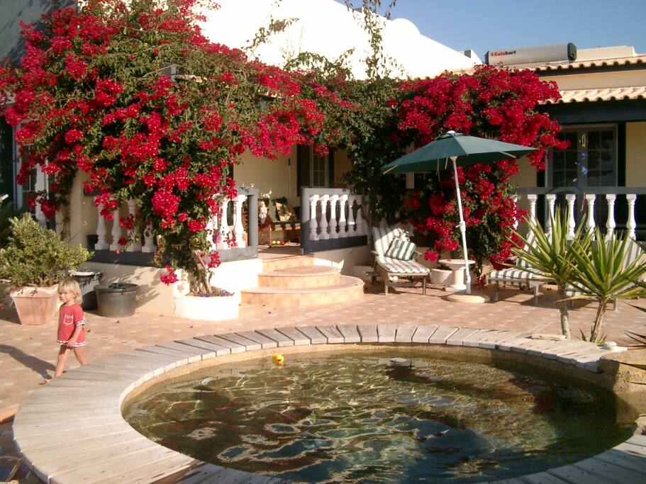 TERRACE AT THE SWIMMING POOL AND JACUZZI.