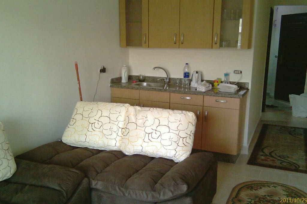 open kitchen with all metal and glass ware, kattel, blender, steam pot, microwave , stove,...etc