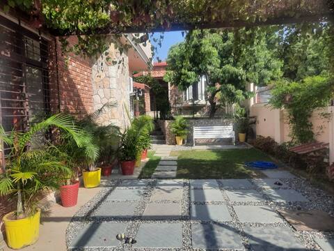 Sunnyside villa and cottages with patio and lawns.