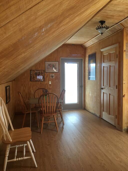 Upstairs common area has separate outside entrance with small balcony overlooking deck.