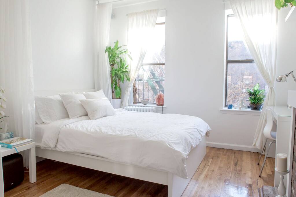 Super comfy queen bed and sheer bed curtains.