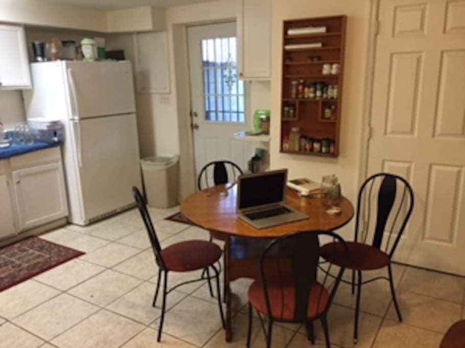 Dining area in the kitchen. Seats four people comfortably, with the option to add more chairs for more guests.
