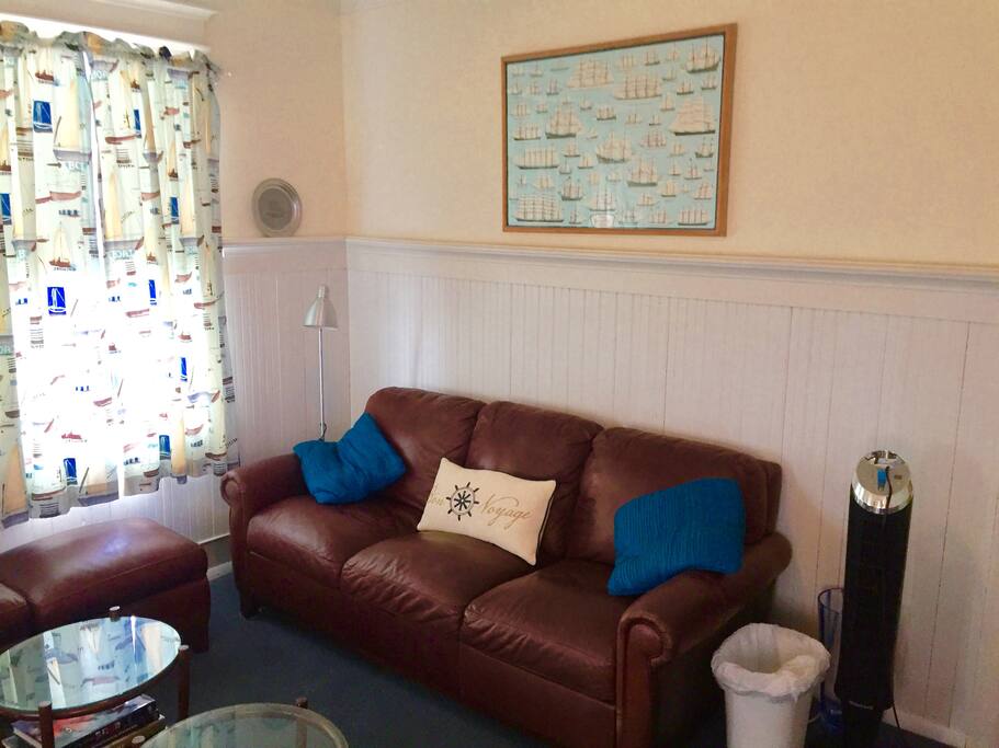 Two leather sofas with 42 flat screen