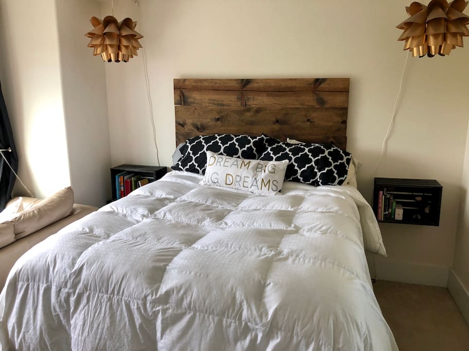 Master bedroom with queen bed, en suite bathroom, 3rd floor view of gorgeous sunset