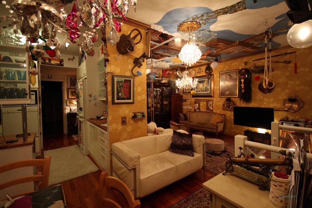 The Dali-inspired living room seen from the corner of the kitchen table and door to the balcony.