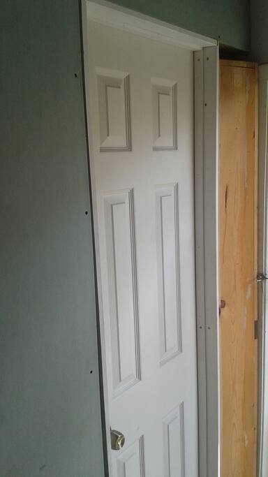 Wall & Locking Door to Small Room