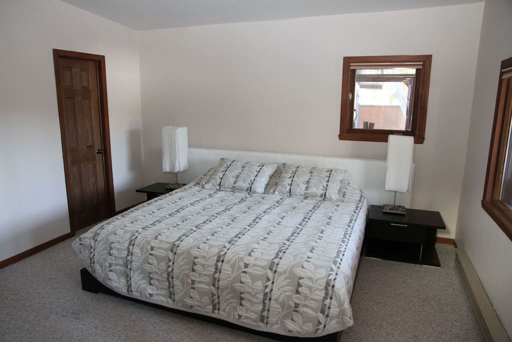 Master bedroom with kingsize bed