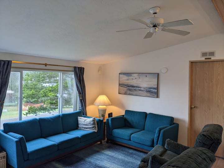 Sea foam colored couches for that coastal decor theme.