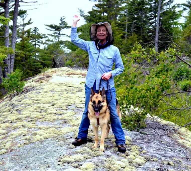 Sue and Quan on a whales back rock formation on one of the many hiking trails around our house.