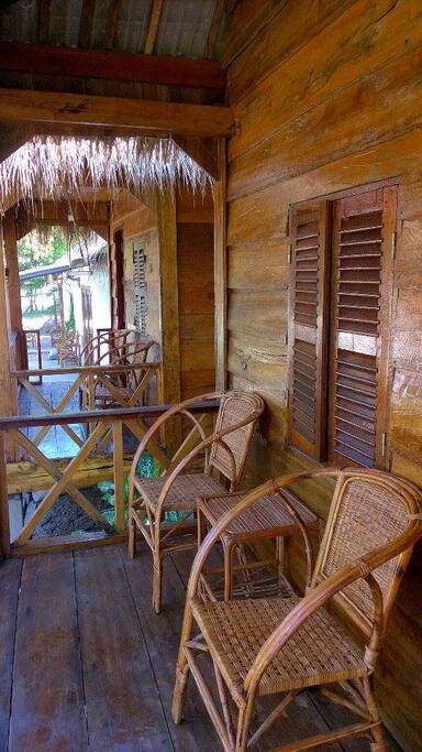 Two wooden bungalows located next to each other