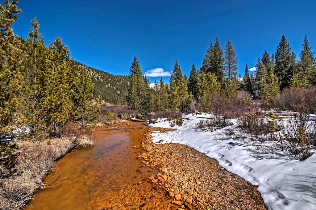 Located on 3 acres of land in the Pike National Forest with a peaceful river running through the property, this home will provide you with tranquility and relaxation.