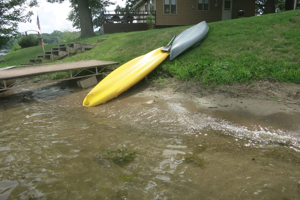 2 kayaks and a small fishing boat with oars are included.