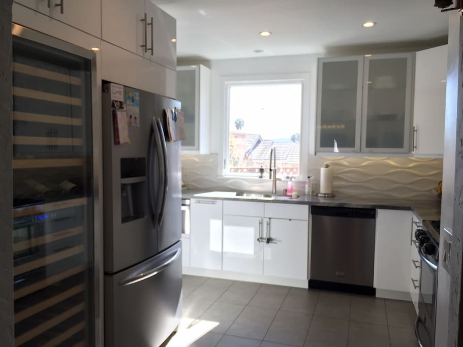 Kitchen with fridge and wine fridge.
