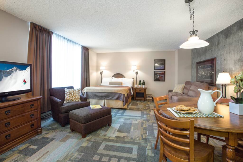 The Canyon Efficiency 1 Bedroom Condo at Iron Blosam by Snowbird includes a queen-size bed, a queen sofabed, a full kitchen and a balcony with canyon views