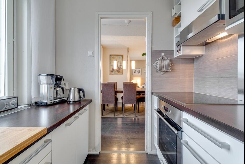 Kitchen with coffee maker, hot water kettle and bread roast.