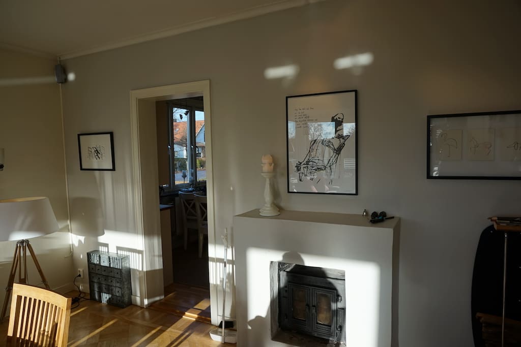 The other side of the main living room. With a fire place and dinning table for 8 persons. Door to the kitchen.