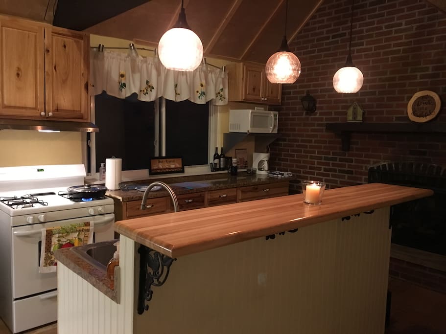 County kitchen overlooking wooded lot