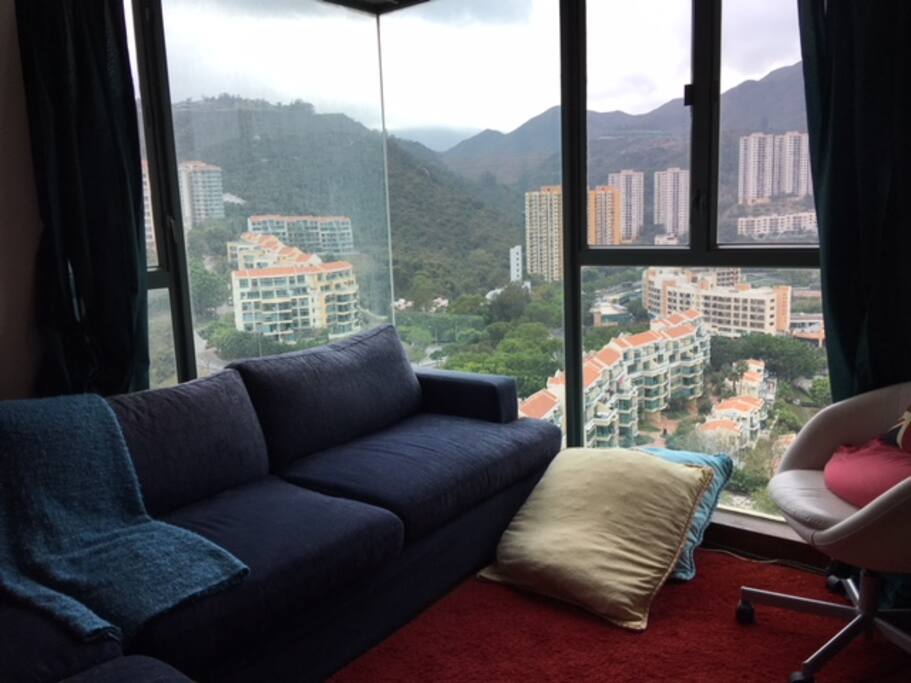 Spacious living room and couch by the window