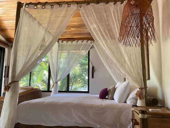 second floor king-size master bedroom bamboo canopy bed
